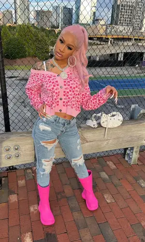 Lakeyah’s Outfit in Off-White Sweater, Crocs Boots & Balenciaga Bag (2022)