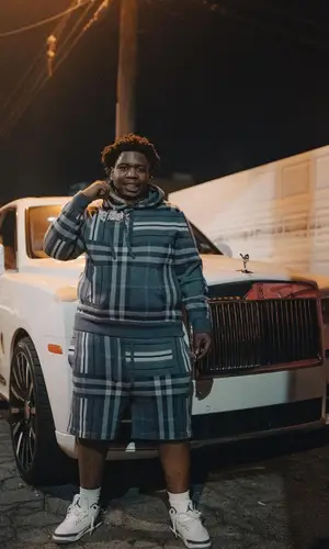 Big30 wearing Burberry shorts
