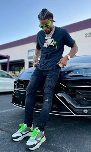 CJ So Cool wearing Versace eyewear