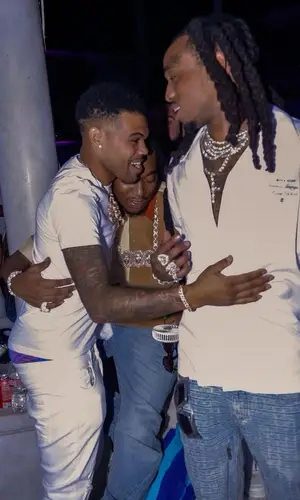 Quavo wearing Givenchy jeans