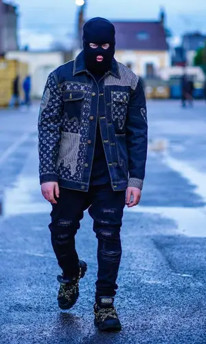 Kalash Criminel wearing Gucci sneakers