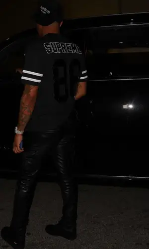 G Herbo wearing Supreme cap