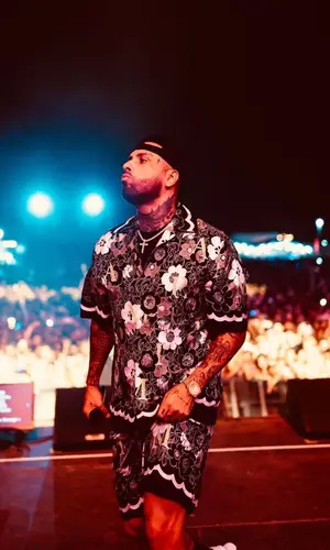 Nicky Jam wearing Amiri shirt