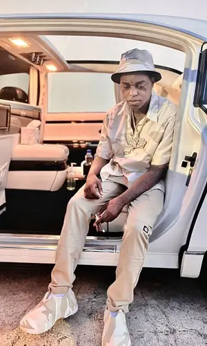 Kodak Black wearing Givenchy shirt