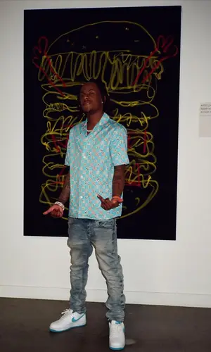 Rich The Kid wearing Louis Vuitton shirt