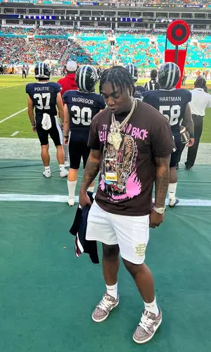 Fredo Bang’s Outfit in Warren Lotas T-Shirt, Eric Emanuel Shorts & Amiri Socks (2022)