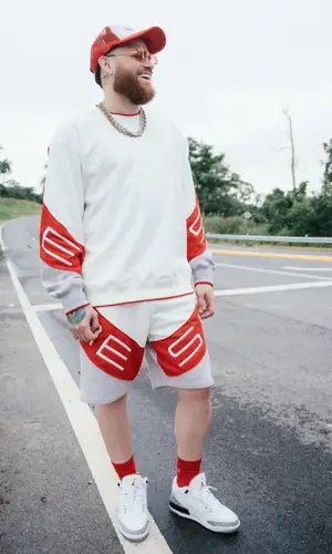 Miky Woodz wearing Supreme sweatshirt