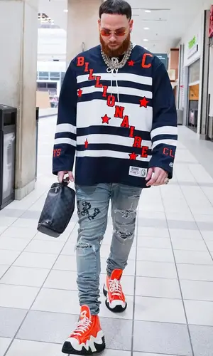 Miky Woodz wearing Amiri jeans