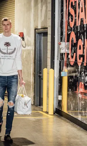Kristaps Porzingis wearing Ih Nom Uh Nit sweater