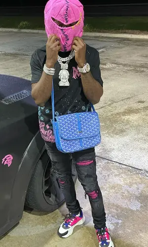 Jackboy wearing Goyard bag