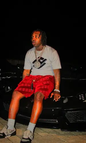EST Gee wearing Fendi shorts