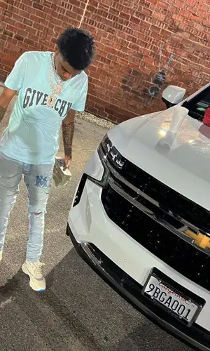 Lil Poppa wearing Givenchy t-shirt