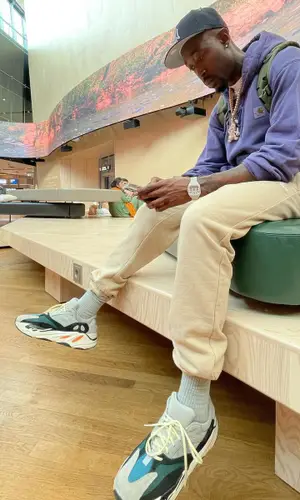 Freddie Gibbs wearing Louis Vuitton bag