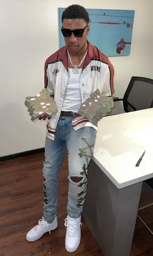 Rob49 wearing Amiri belt