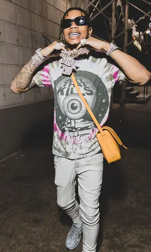 Lil Migo wearing Goyard bag