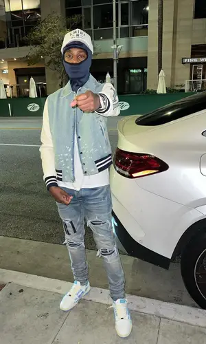 Lil Tjay wearing Amiri jacket