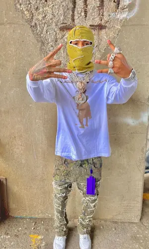 NLE Choppa wearing Slime Hearts t-shirt