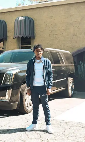 Lil Pj wearing Nike sneakers