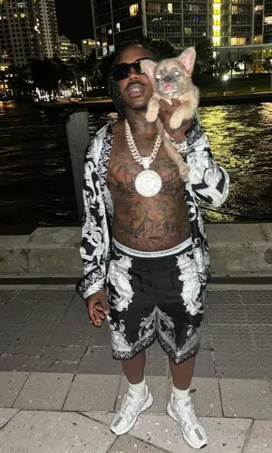 EST Gee wearing Versace shorts