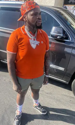 Fat Boy wearing Moncler shirt