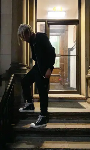 Lil Playah wearing Rick Owens sneakers