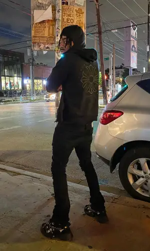 Lil Playah wearing Prada backpack