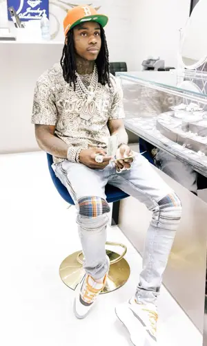 Polo G wearing New Era cap