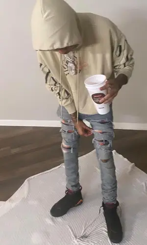 Lil Poppa wearing Off-White hoody