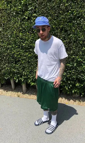 Mac MIller wearing Champion shorts
