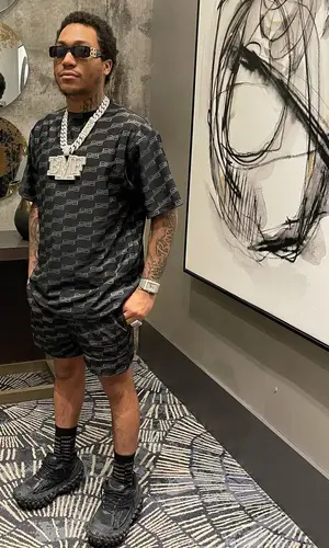 Lil Meech wearing Balenciaga shorts