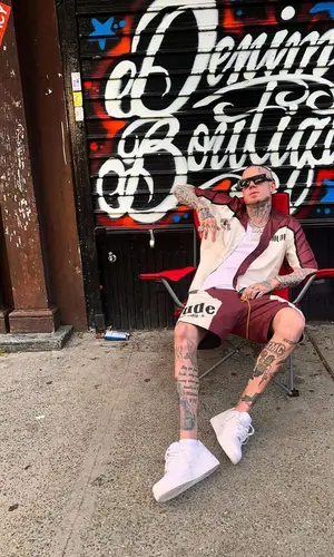 Millyz wearing Rhude shirt