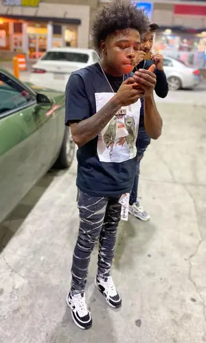 Anti Da Menace wearing Supreme t-shirt