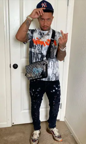 MBNel wearing Louis Vuitton bag
