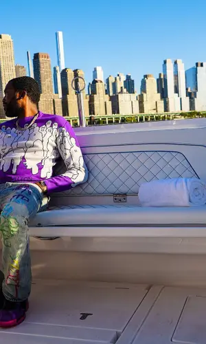 Meek Mill wearing Louis Vuitton sweater