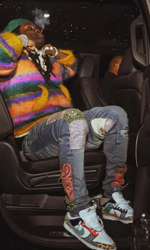 Chief Keef’s Outfit in Marni Sweater, Amiri Jeans & New Era Cap (2022)