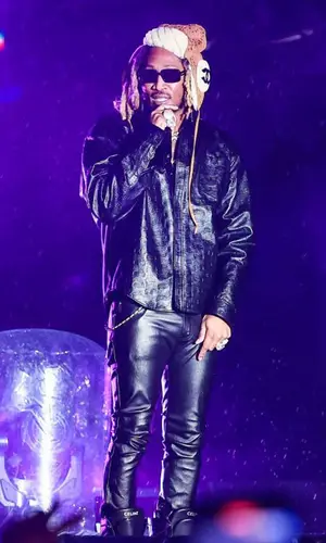 Future wearing Celine boots
