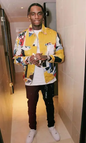 Soulja Boy wearing Purple Brand shirt