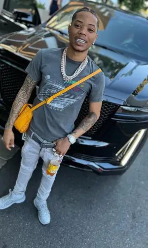 Lil Migo wearing Goyard bag