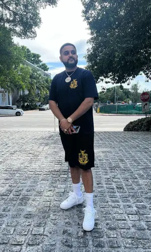 Nav wearing Xvi shorts