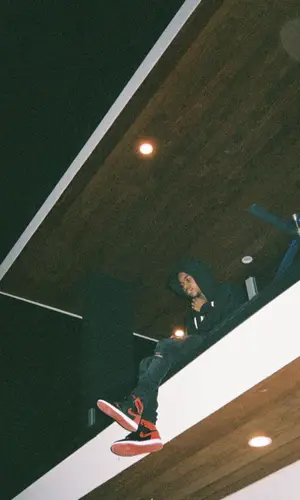 Lil Poppa wearing Amiri t-shirt