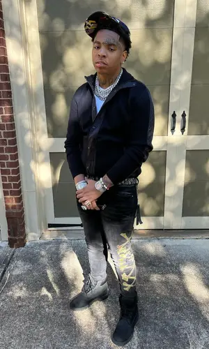 Lil Gotit wearing Amiri jeans