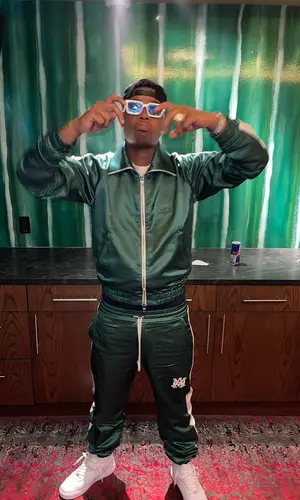 Sha EK wearing Amiri jacket