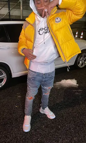 Sha EK wearing Moncler jacket