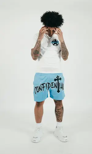 Mikey wearing Confidential shorts