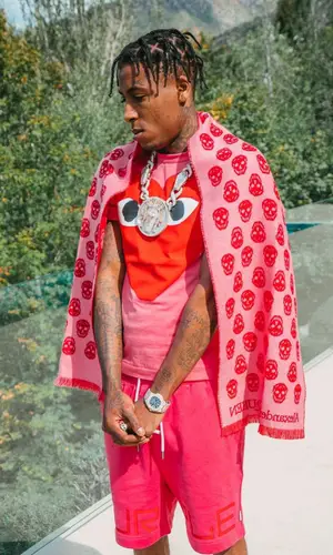 NBA YoungBoy wearing Comme Des Garcons t-shirt