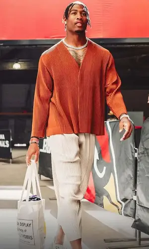 Isaiah Simmons wearing Issey Miyake jacket