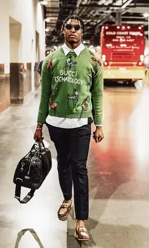 Isaiah Simmons wearing Gucci sweater