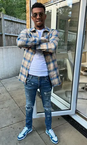MoStack wearing Ray-Ban eyewear