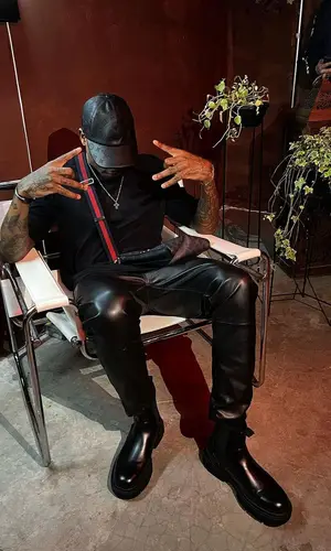 Dfideliz wearing Louis Vuitton cap