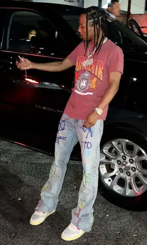 Pressa wearing Who Decides War jeans